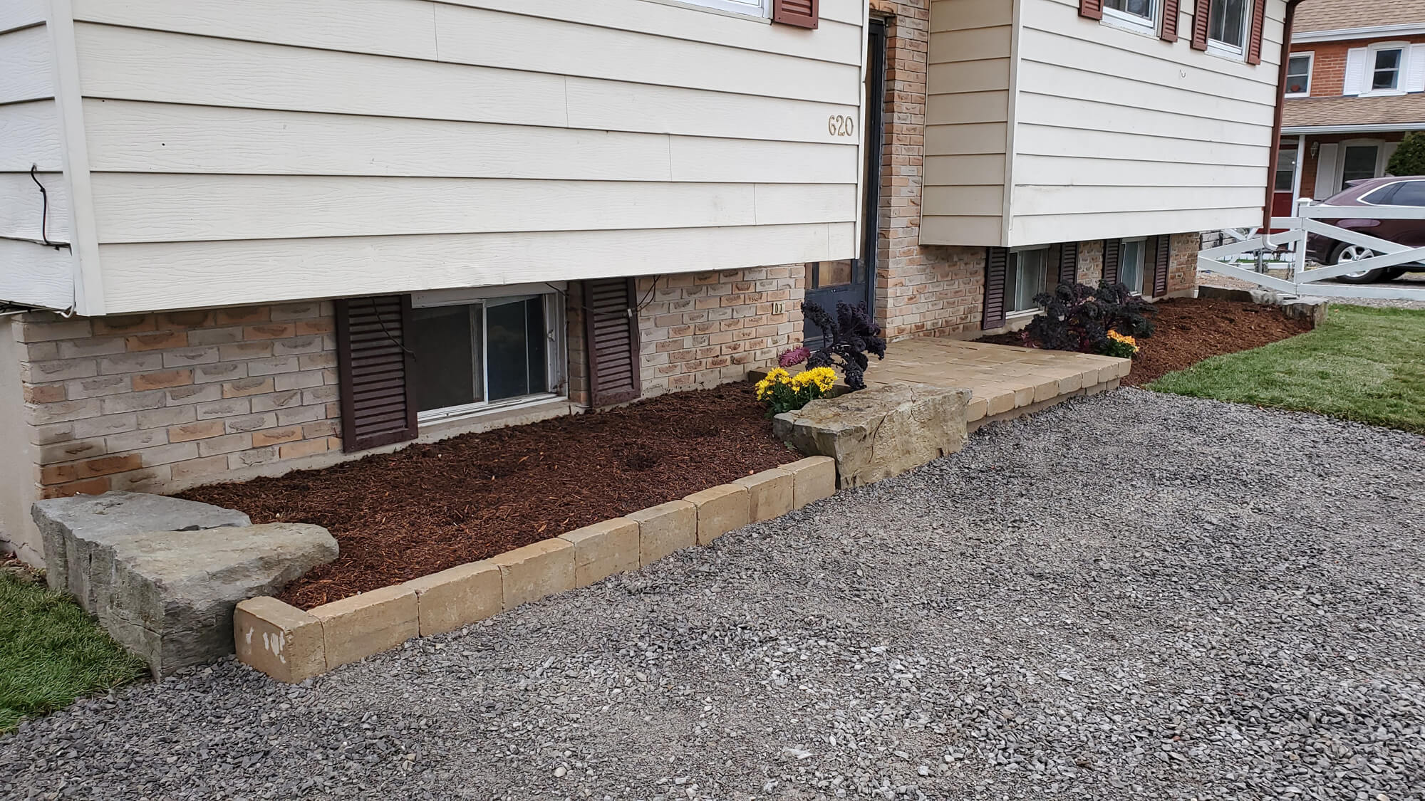 front of house with new garden beds