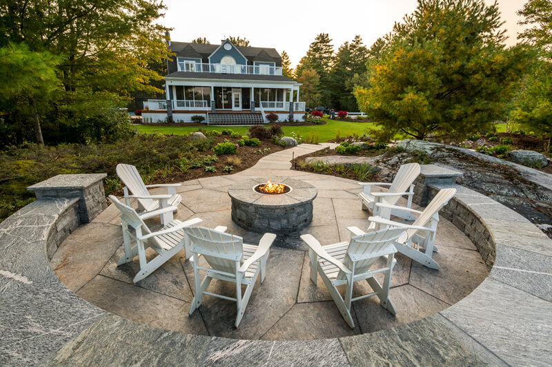 outdoor firepit with chairs around it